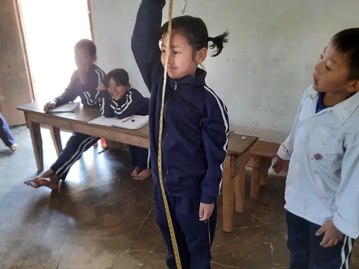 Students at their desks in a classroom at the Center, Educere Learning Center