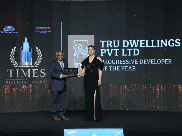 TRU Dwellings receiving the Progressive Developer of the Year award on stage at the Times Real Estate Awards 2026