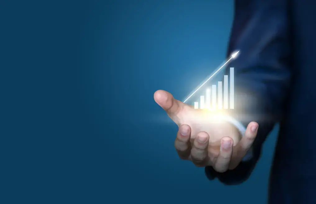 TRU Capital: a hand holding a rising chart